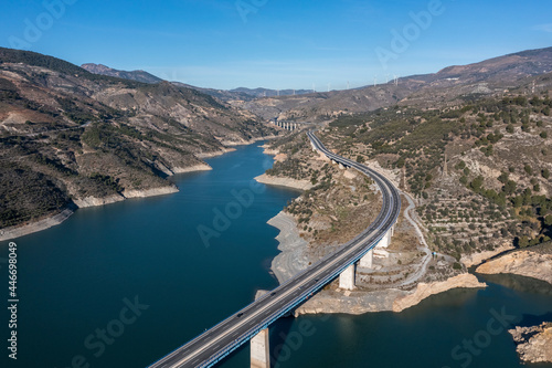 Aerial view of a suspended bridge crossing Guadalfeo river near Granada, Andalusia, Spain. photo