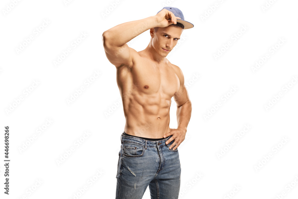 Fototapeta premium Shirtless male model with a cap and jeans looking at camera