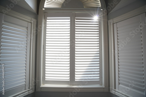 View of Bedroom with Window Shutter Blinds