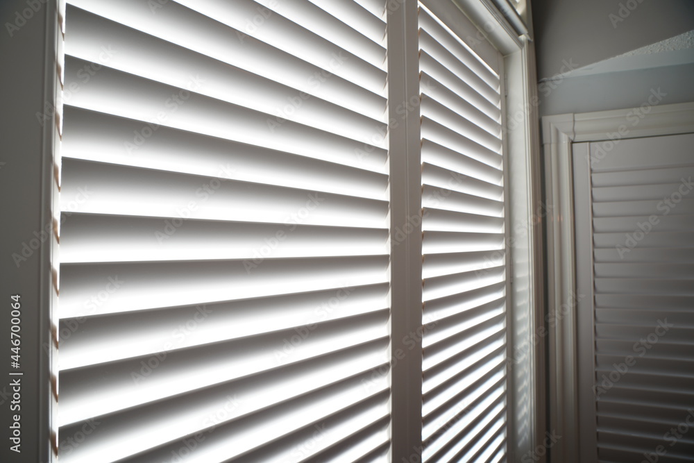 Interior of a bedroom with window shutter blind s Interior of a bedroom with window shutter blind s