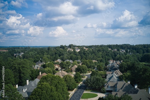 Aerial view of a sub division with beautiful landscape and houses