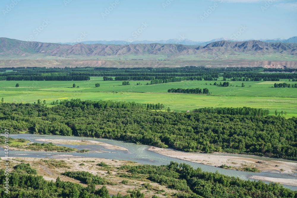 Grassland and mountains in a sunny day. Grassland and mountains in a sunny day.