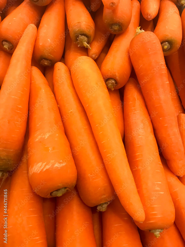 Macro Photo spring food vegetable carrot. Texture background of fresh large orange carrots. Product Image Vegetable Root Carrot Macro Photo spring food vegetable carrot. Texture background of fresh large orange carrots. Product Image Vegetable Root Carrot