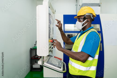 African American technician engineer operating milling cutting machine