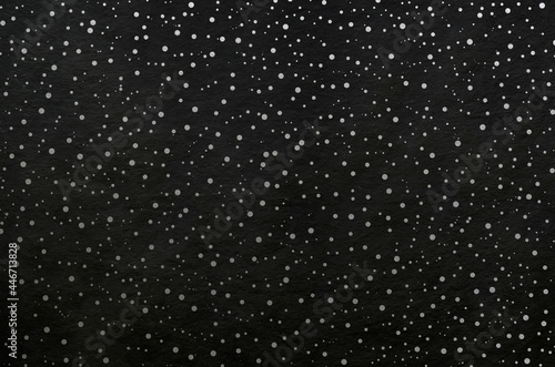 Black washi paper with silver snowy sky landscape pattern. Japanese traditional craftsman's handmade paper texture background