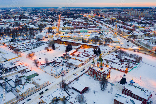 Aerial panoramic view of snow covered cityscape of Kolomna overlooking medieval Kremlin on winter evening Russia