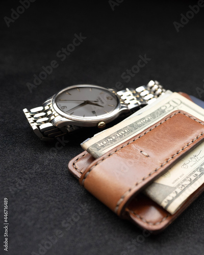 Billfold Wallet and Watch on Table