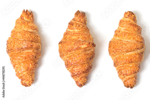 three tasty croissants on white background. French breakfast. Flatly