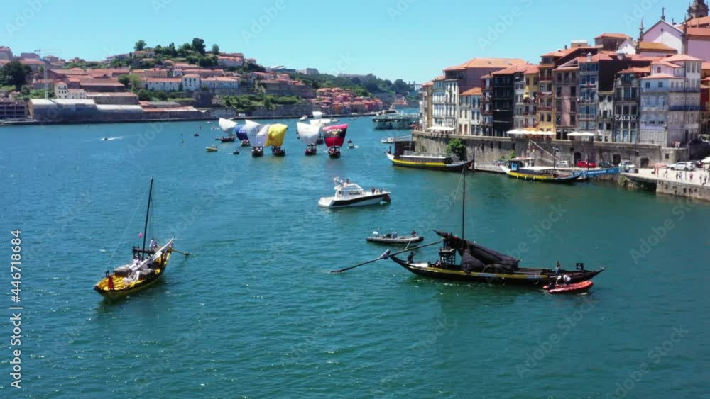 Aerial drone shot of Fonseca Rabelo cargo Boat and Regatta of ships in background during event on Douro River Aerial drone shot of Fonseca Rabelo cargo Boat and Regatta of ships in background during event on Douro River