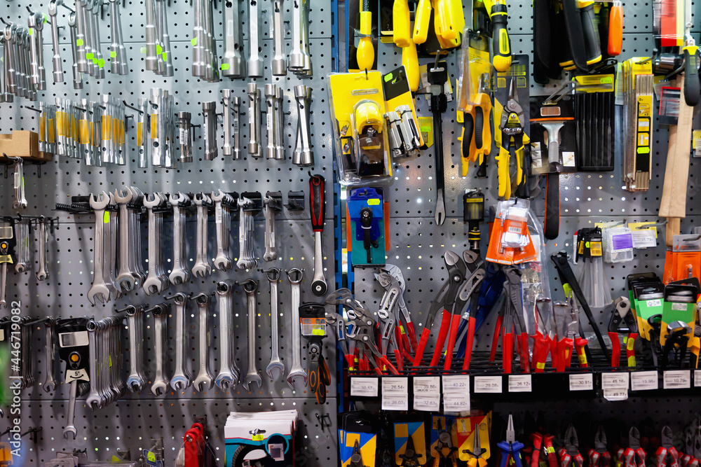 Various repair tools for sale on hardware store showcase . Photos | Adobe  Stock