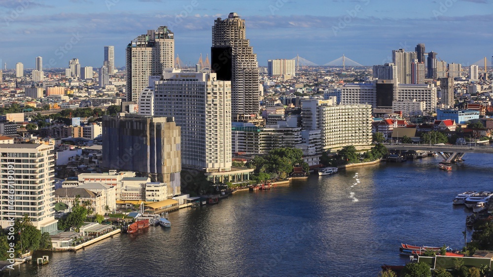 Fototapeta premium aerial panoramic landscape view of urban area with Chao Phraya River in Bangkok, Thailand