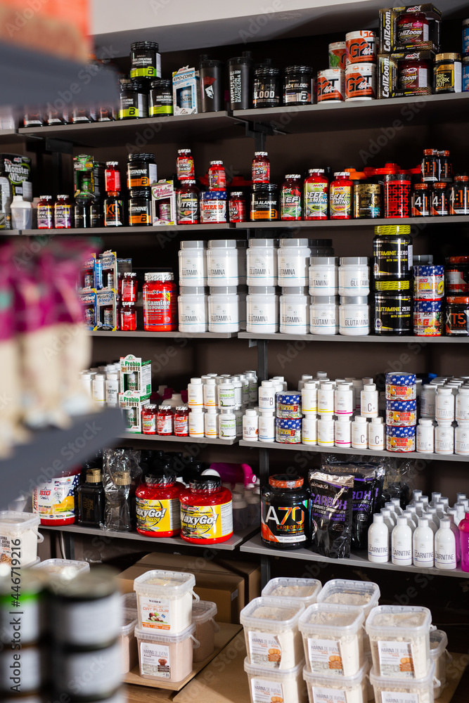 BARCELONA, SPAIN - SEPTEMBER 20, 2019: Shelves with dietary supplements,  vitamins and minerals in sports nutrition shop. Stock-Foto | Adobe Stock