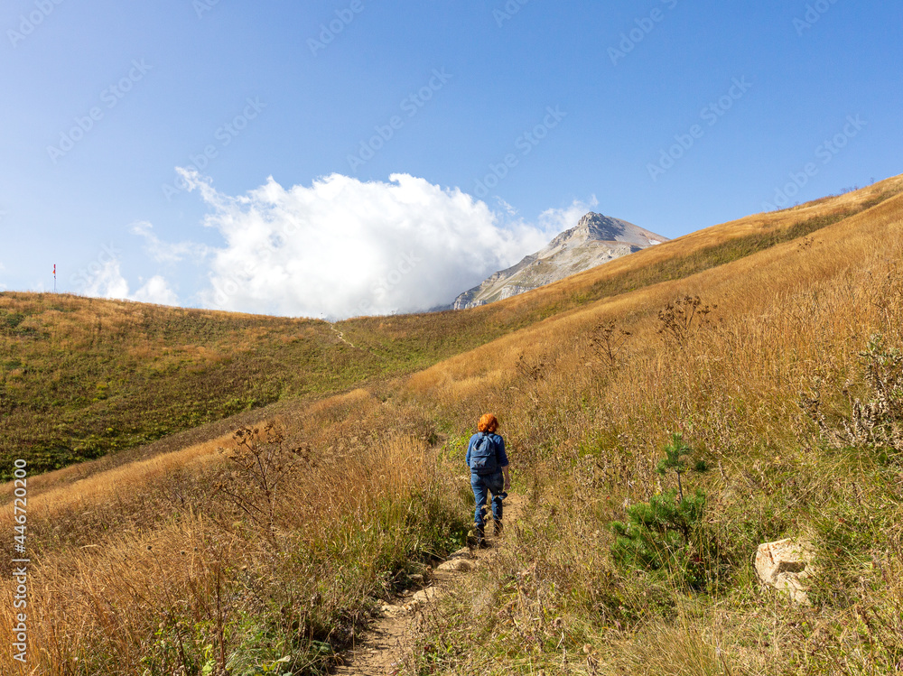 Panoramic views of the mountains from hiking trails in the mountainous area on a warm, sunny autumn day, walking and communicating with nature.