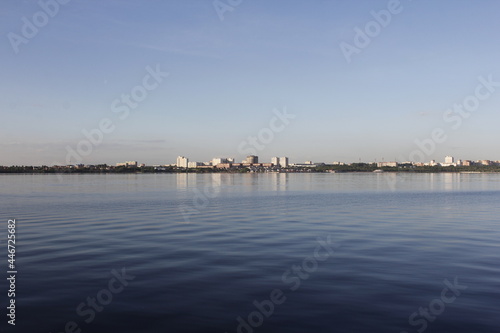 View from the Volga river to the city of Togliatti. Togliatti city on the river bank. © Илья Юрукин