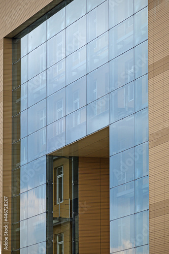 A fragment of the facade of a modern building on a summer day