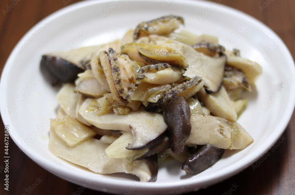 Abalone and oyster mushroom stir-fry. The concept of food and health.
