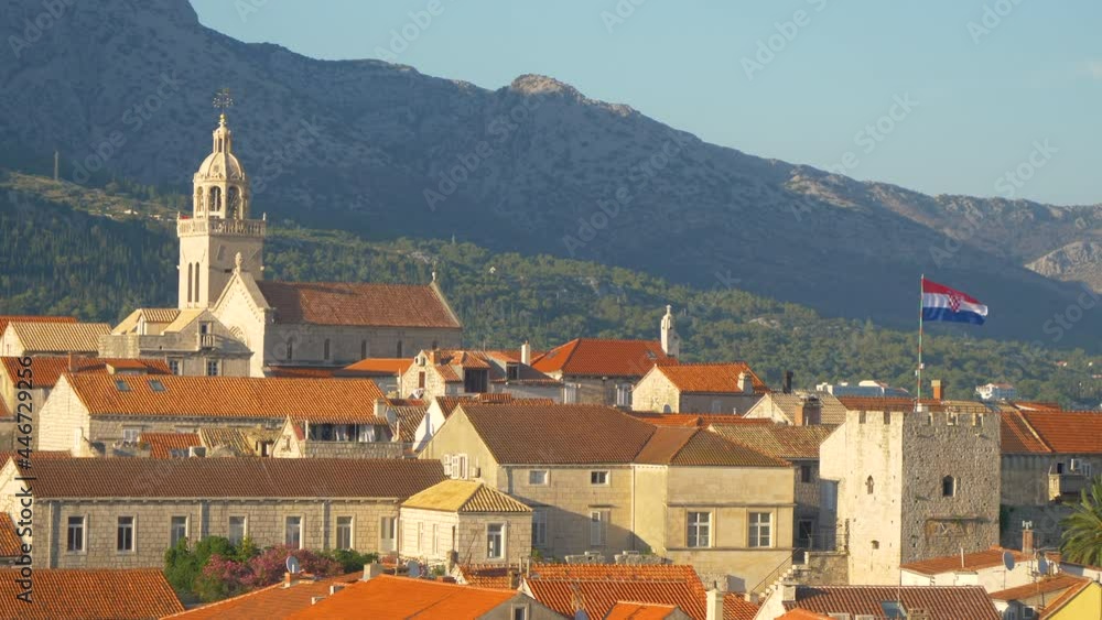 Spectacular view of the red rooftops of the ancient medieval town of Korcula on a sunny summer day. Picturesque shot of a quiet historic city on a remote island in the beautiful Croatian Adriatic sea. Spectacular view of the red rooftops of the ancient medieval town of Korcula on a sunny summer day. Picturesque shot of a quiet historic city on a remote island in the beautiful Croatian Adriatic sea.