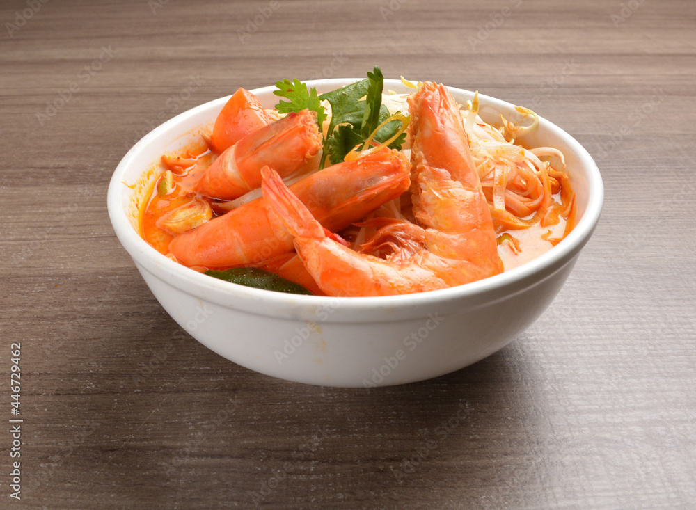 braised cook big fresh tiger prawn with red spicy curry soup in wood background asian halal menu braised cook big fresh tiger prawn with red spicy curry soup in wood background asian halal menu