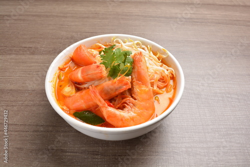 braised cook big fresh tiger prawn with red spicy curry soup in wood background asian halal menu