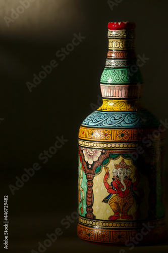 Close-up of a bottle painted in the traditional Patachitra style of Odisha, India