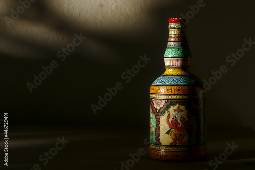 Close-up of a bottle painted in the traditional Patachitra style of Odisha, India