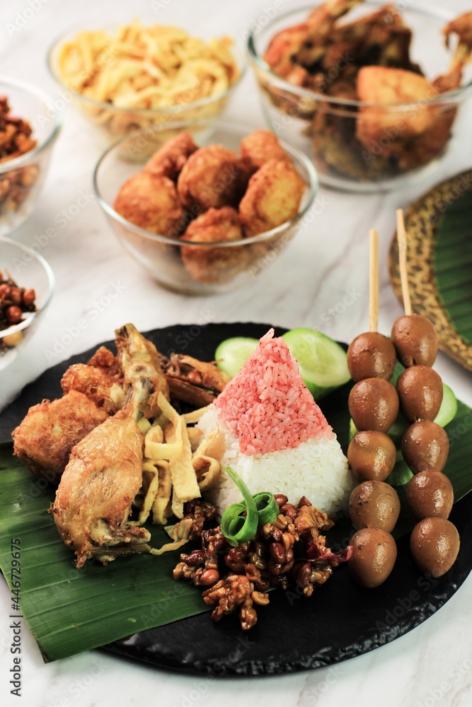 Red and White Rice Called Nasi Tumpeng Same as Indonesian National Flag for Independence Day Celebration at 17 August. Tumpeng Merah Putih Red and White Rice Called Nasi Tumpeng Same as Indonesian National Flag for Independence Day Celebration at 17 August. Tumpeng Merah Putih
