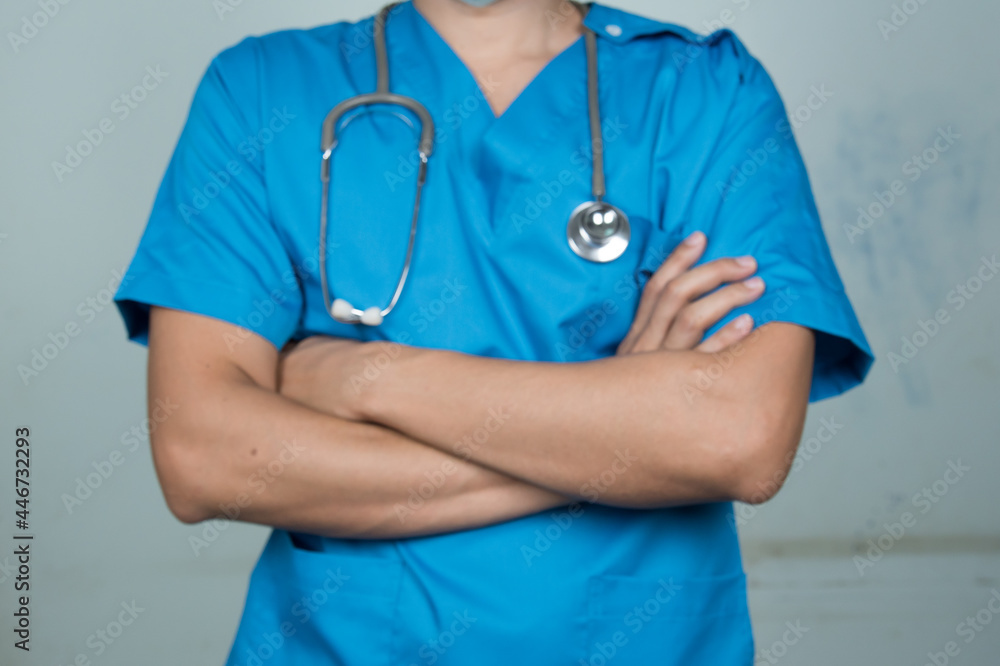 Medical Doctor in uniform ware protection equipment from pathogen. Medical staff in isolated background in hospital. Medical Doctor in uniform ware protection equipment from pathogen. Medical staff in isolated background in hospital.
