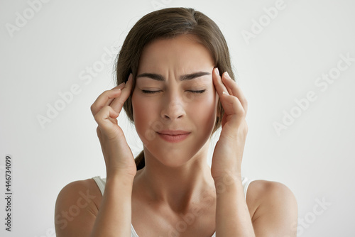 woman with closed eyes headache emotions negative