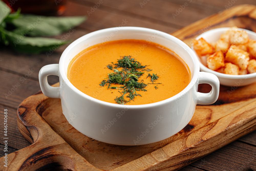 Lentil cream soup with dill and croutons on wooden background Lentil cream soup with dill and croutons on wooden background