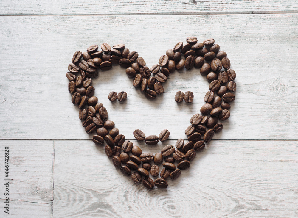 Coffee seed face smile happy on wood background top view idea coffee concept copy space Coffee seed face smile happy on wood background top view idea coffee concept copy space