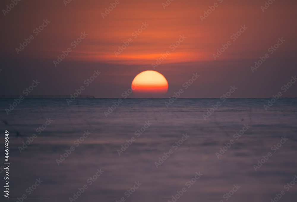 Sunset in sea with creative blue and red abstract landscape