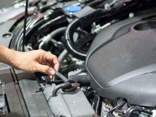 Hand checking equipment interior engine of car