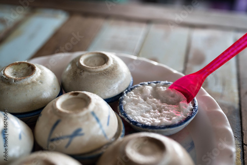 Thai Coconut Milk Custard - Khanom Thuai (Thai dessert) - Thai Coconut Milk Custard is a traditional dessert with 3 main ingredients (flour, coconut milk and palm sugar). photo