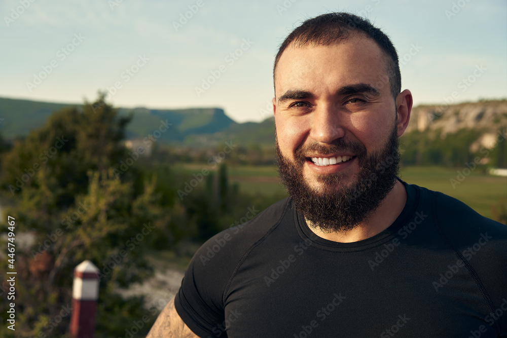 Young bearded man portrait outdoors in the mountains Young bearded man portrait outdoors in the mountains