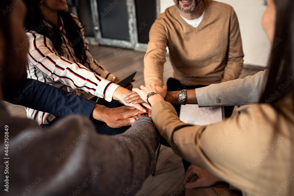 Fototapeta premium Group of diverse group of business people having a meeting while sitting in circle.