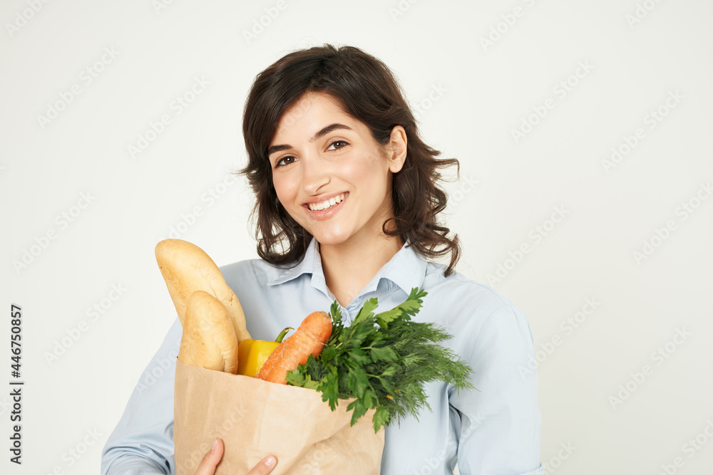 woman with a package of groceries vegetables supermarket shopping woman with a package of groceries vegetables supermarket shopping