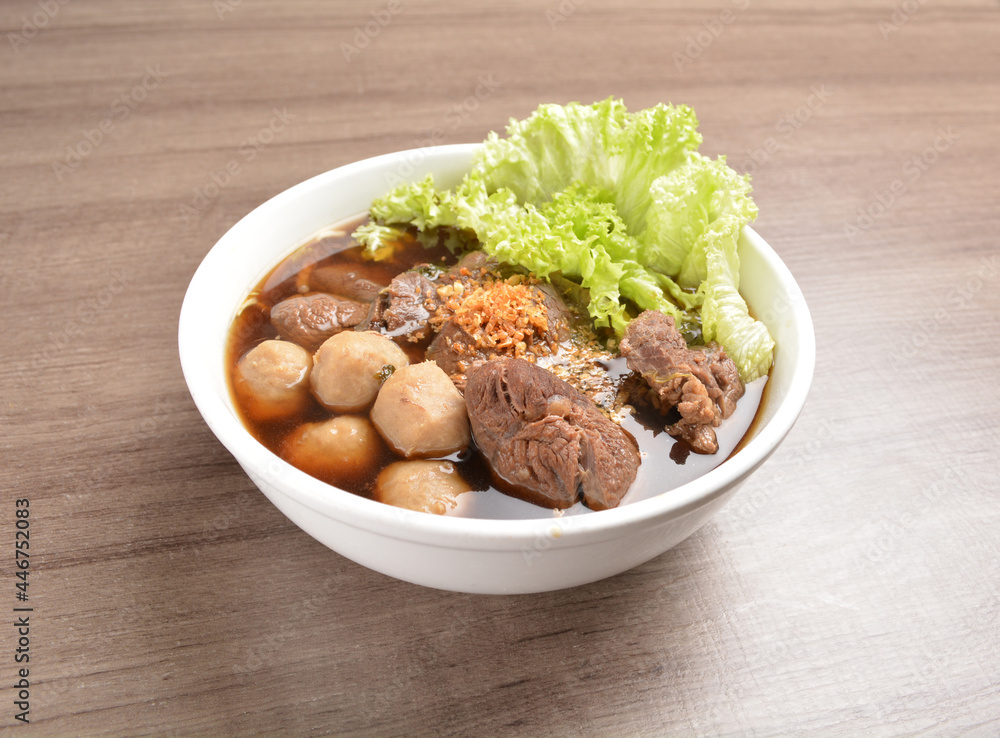 Vietnamese braised beef meat ball hot soup bowl in wood background asian halal menu Vietnamese braised beef meat ball hot soup bowl in wood background asian halal menu