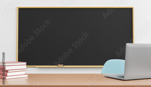 blackboard and laptop on teacher's table