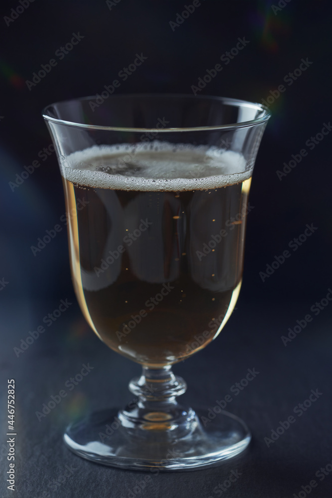 Glass of beer on dark background. Close up.	