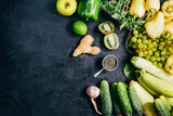 top view of green vegetables and fruits on black background with free space for text