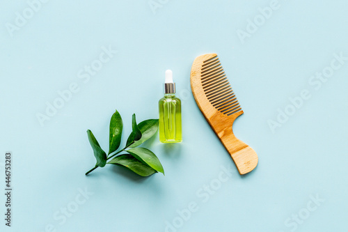 Herbal hair oil for treatment with wooden hair comb