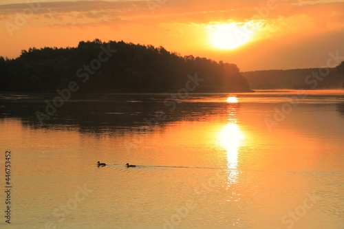 Orange dawn over the great Siberian river Biya photo
