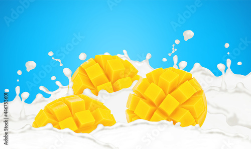 Cutted mango in milk splashes isolated on a blue background.