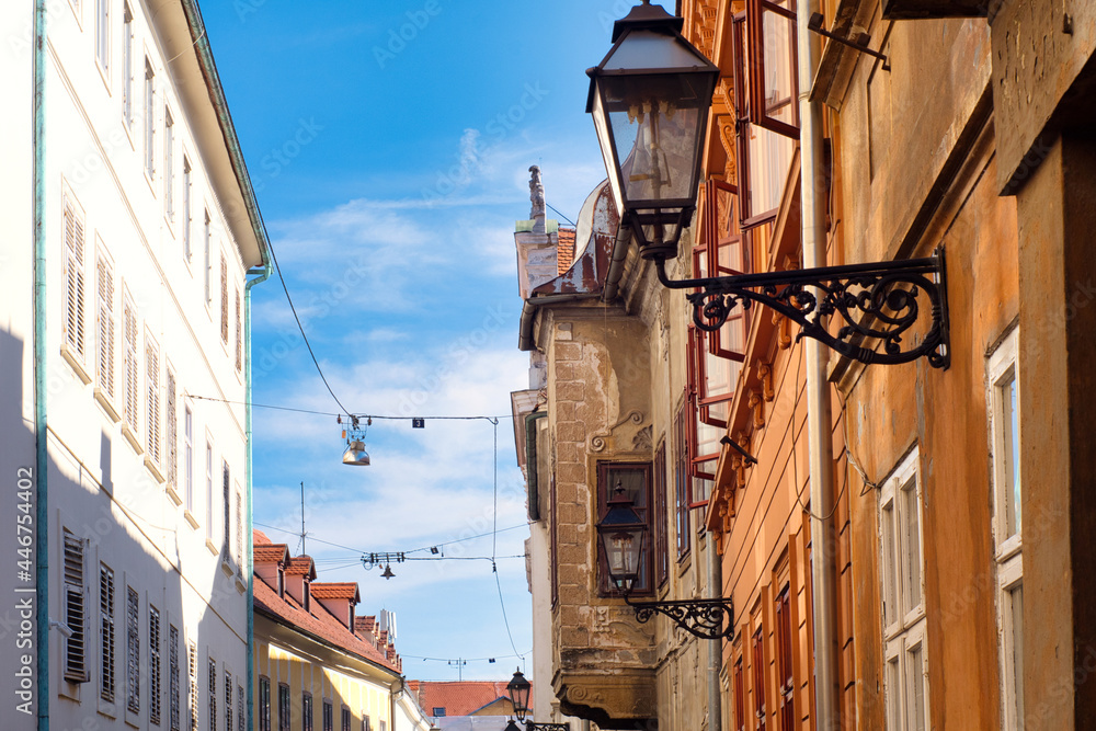 Narrow medieval street with historic architecture in the tourist center of Gornji Grad - old Upper town of Zagreb, Croatia