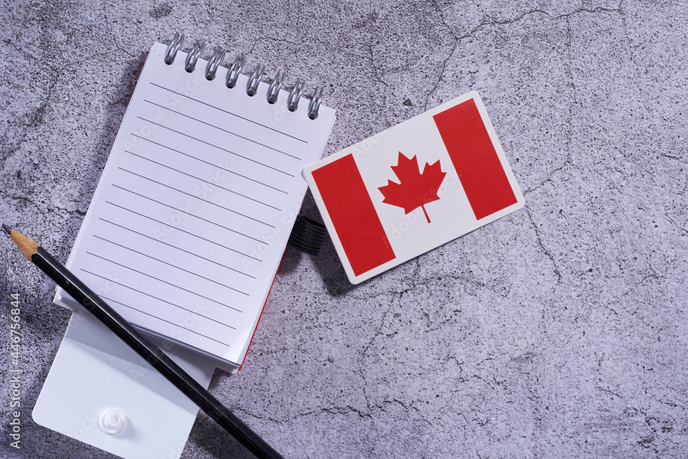 Canada flag and blank notpad