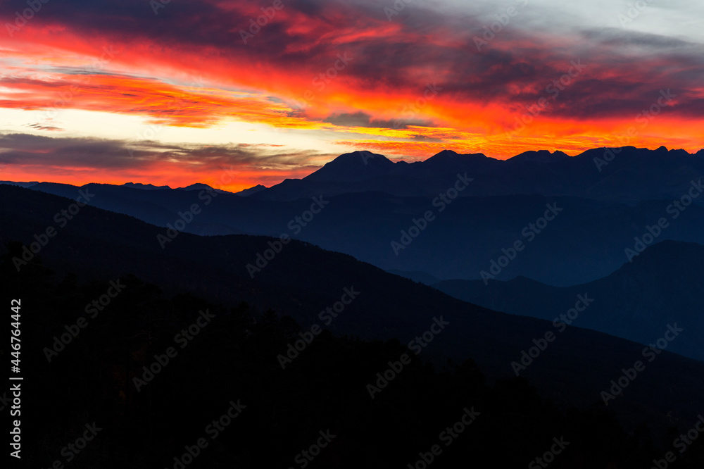 colorful sky at sunset behind the mountains with different shades