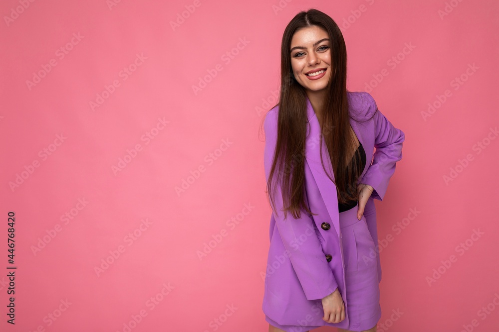 Young happy smiling brunette woman nice-looking attractive charming elegant fashionable wearing stylish suit with jacket isolated over pink background with copy space Young happy smiling brunette woman nice-looking attractive charming elegant fashionable wearing stylish suit with jacket isolated over pink background with copy space