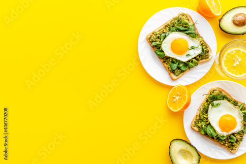 Sandwich with eggs avocado cream and spinach  top view