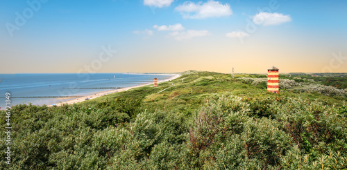 Panoramic coastal landscape with lighthouse in the dunes at the beautiful beach of Dishoek, Zeeland, The Netherlands.