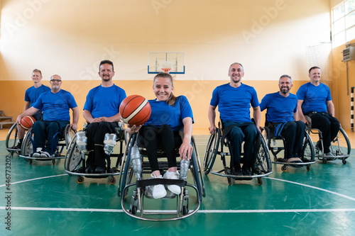 photo of the basketball team of war invalids with professional sports equipment for people with disabilities on the basketball court